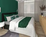 Elegancka, zielona sypialnia z wygodnym łóżkiem, ozdobnym zagłówkiem i stylowymi dodatkami.