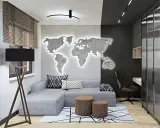 Nowoczesny męski pokój inspiracje: szara kanapa, podświetlana mapa świata na ścianie, drewniane stoliki i biurko.
