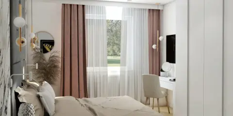 Przytulna aranżacja małej sypialni z dużą białą szafą, łóżkiem i toaletką.