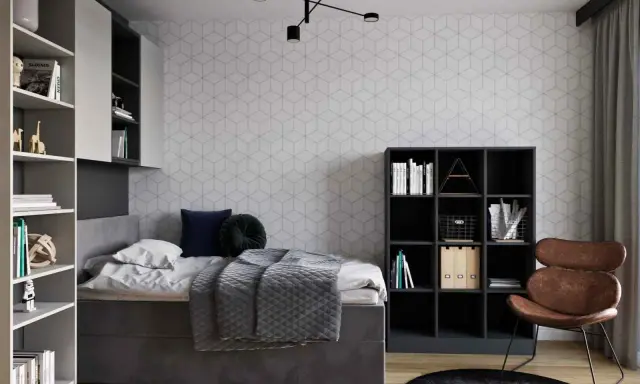 Nowoczesny pokój młodzieżowy dla dziewczyny: inspiracje. Szara tapeta w geometryczne wzory, wygodne łóżko, regały i stylowy fotel.