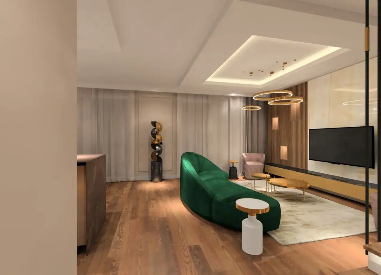 Nowoczesny salon z sofą w kształcie fali w kolorze głębokiej zieleni. W tle widoczne zielone ściany w salonie, kt&oacute;re dodają elegancji.